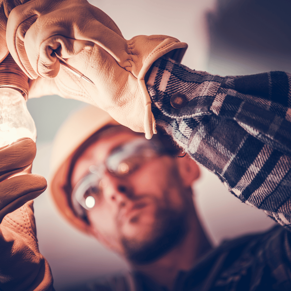 male electrician is repairing with a screwdriver